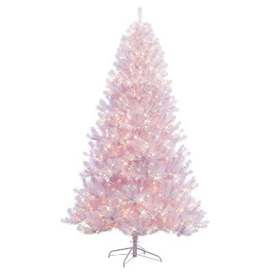 a pink christmas tree with white lights on it