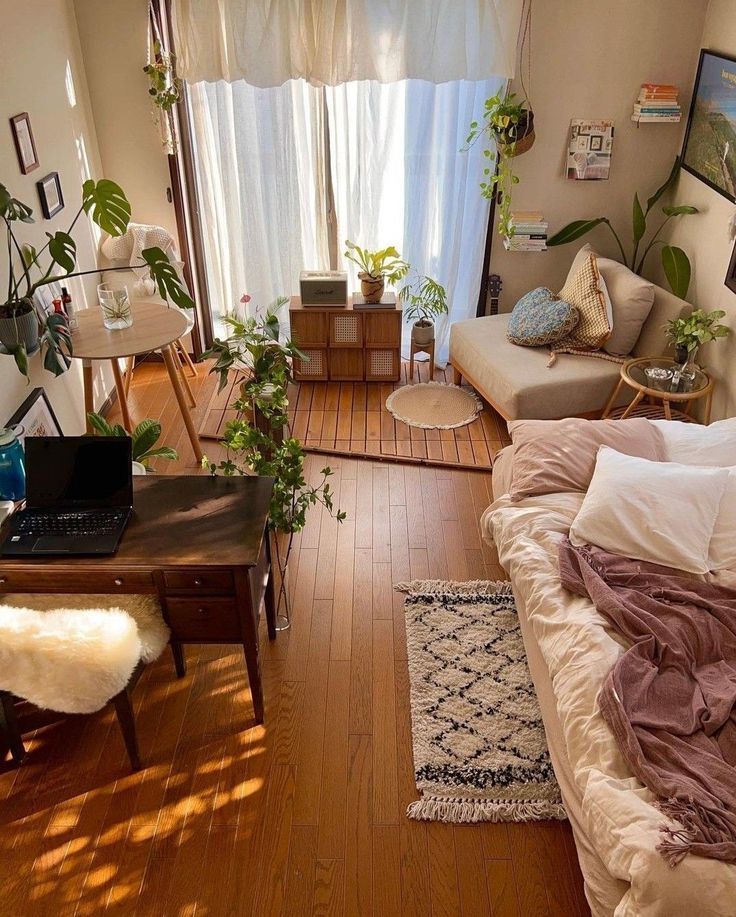 a living room filled with furniture and lots of plants