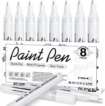 eight white marker pens with black ink on them