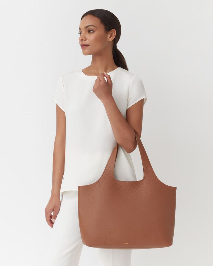 A chic solution to maximizing space. Crafted in our signature Italian leather inside and out, this softly structured tote is fully customizable thanks to interior snaps that allow you to add and remove organizational accessories as needed — from a laptop sleeve to pouches that double as a clutch for post-work events. Cuyana Bag, Tote Insert, Small Leather Accessories, Leather Laptop Sleeve, Leather Industry, Laptop Tote, Leather Laptop, Flap Bag, Leather Accessories