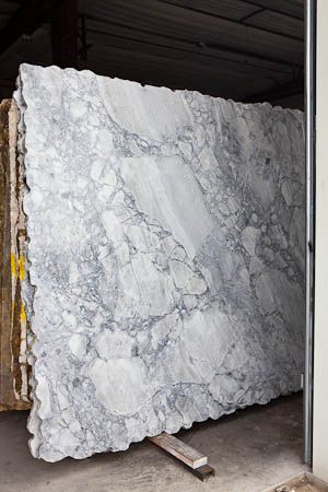 a large slab of white marble in a warehouse