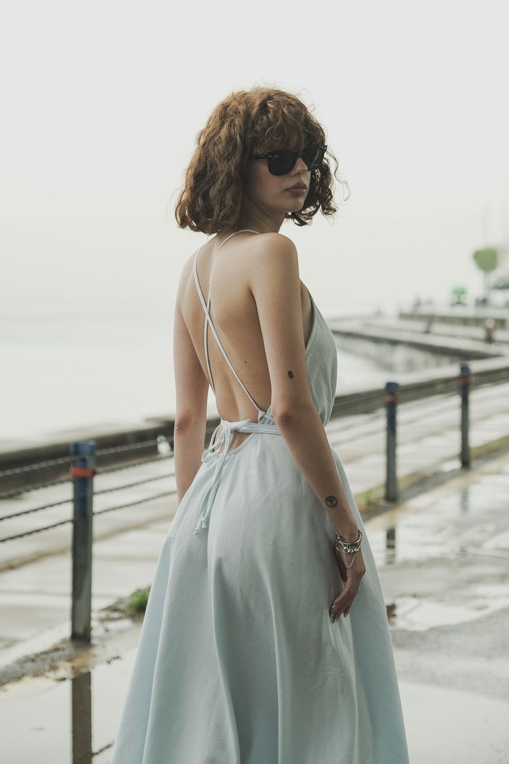 Our stylish, must-have version of the essential LBD (little ​beach dress), the Sage Maxi Dress Baby Blue is a flowing asymmetric dream that’s perfect for mid-summer events, beach days, and travel. The silhouette is inspired by the tranquil vibes of Tulum’s beaches and bustling energy of its town center. It features long straps you can wrap twice around the waist for an adjustable fit. Breathable fibers keep you cool as you lounge, explore, and indulge all summer long. Sage Maxi Dress, Dress Baby Blue, Mid Summer, Town Center, Summer Events, Beach Days, Beach Dress, Tulum, Asymmetric Hem