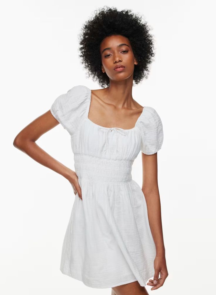 KAY DRESS | Aritzia Billowy Short Sleeve Mini Dress For Summer, Billowy Puff Sleeve Mini Dress For Summer, Summer Puff Sleeve Mini Dress With Gathered Neckline, Summer Mini Dress With Puff Sleeves And Gathered Neckline, Feminine Mini Dress With Smocked Bodice And Puff Sleeves, Feminine Cotton Puff Sleeve Dress With Smocked Bodice, Spring Ruched Cotton Puff Sleeve Dress, Spring Cotton Puff Sleeve Ruched Dress, Spring Ruched Puff Sleeve Cotton Dress