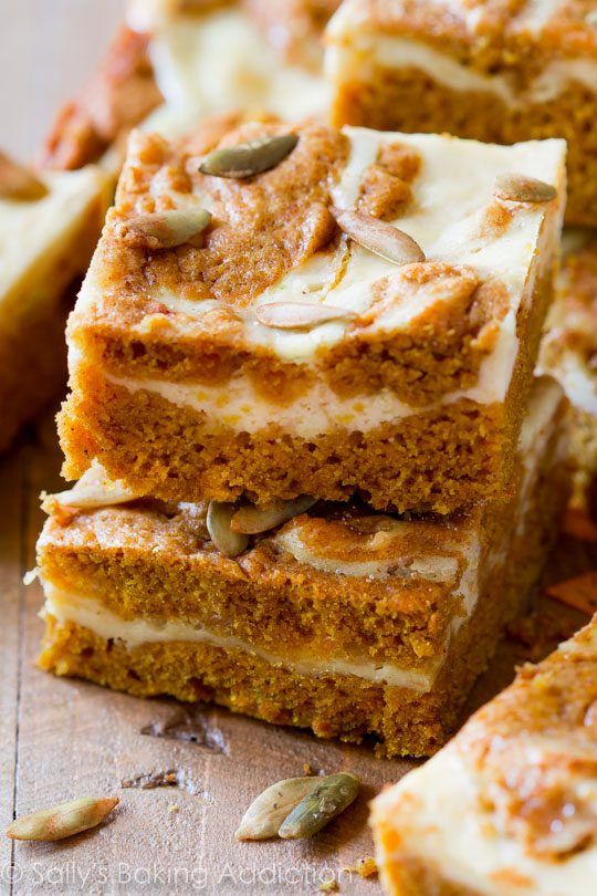 several pieces of cake sitting on top of a wooden cutting board