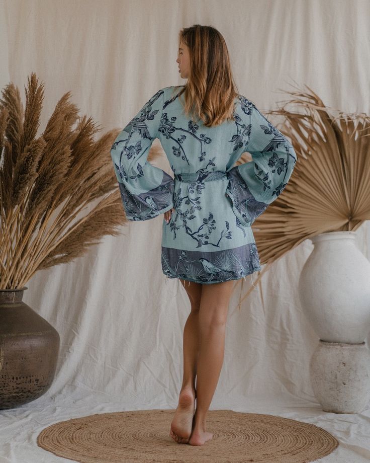 Wrap yourself in the embrace of our Elsa Kimono, a garment that gracefully blends eco-conscious luxury with a serene aesthetic. This exquisite kimono, reversible in nature, offers two tranquil hues – a deep, calming blue and a gentle ice blue, each reflecting a facet of peace and mindfulness. Tailored for a relaxed yet elegant fit, we suggest selecting a size that's 15-20 cm (6-8 inches) larger than your chest circumference, ensuring a comfortable and serene wearing experience. This kimono is mo Chic V-neck Summer Sleepwear, Spring Loungewear Tops With Kimono Sleeves, Flowy Spring Sleepwear For Vacation, Flowy Sleepwear For Spring Vacation, Spring Bohemian Loungewear Tops, Chic V-neck Sleepwear For Spring, Chic Relax Fit Sleepwear For Vacation, Chic Relaxed Fit Sleepwear For Vacation, V-neck Sleepwear For Beach In Spring