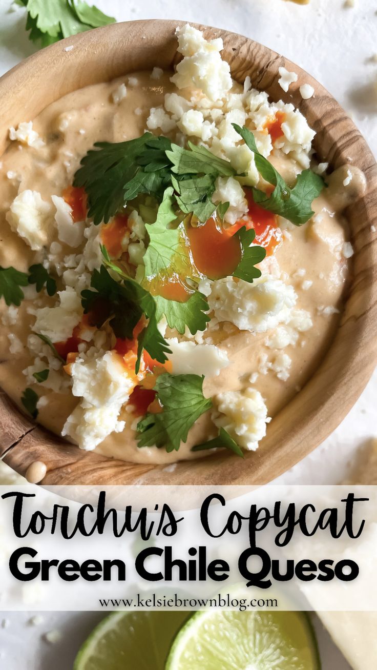 a wooden bowl filled with cauliflower and garnished with cilantro