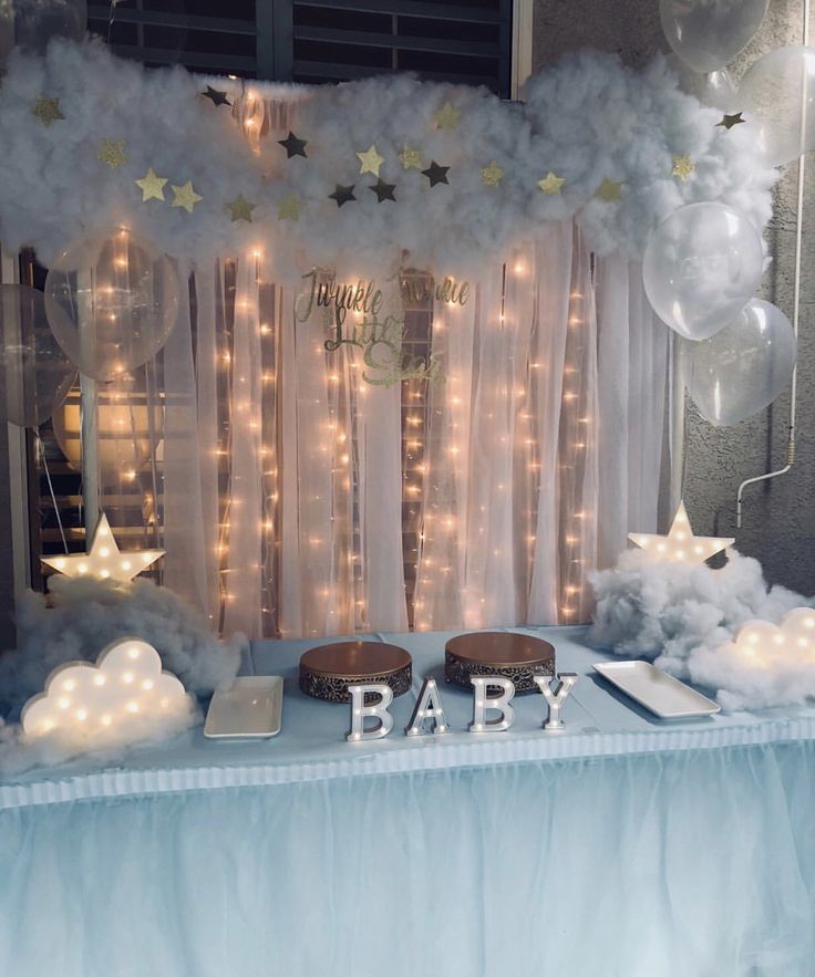 a baby shower is set up with balloons and stars