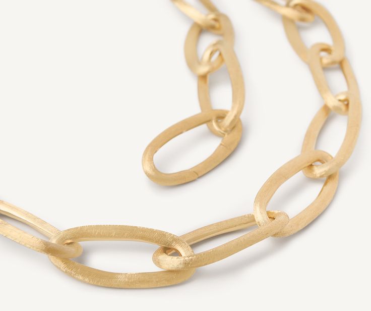 This bold and elegant necklace features a balanced play of full and empty volumes. The chain is made up of oval elements in 18K yellow gold, finely hand-engraved using the ancient Florentine technique which gives our gold a fine, brushed texture. Luxury Gold-tone Oval Link Jewelry, 14k Gold Tarnish-resistant Oval Link Necklace, Yellow Gold Oval Link Necklace, Tarnish Resistant, Luxury Gold-tone Oval Link Necklace, 14k Gold-filled Oval Link Necklace With Adjustable Chain, Ancient Tools, Marco Bicego, Sara Sampaio, The Ultimate Gift