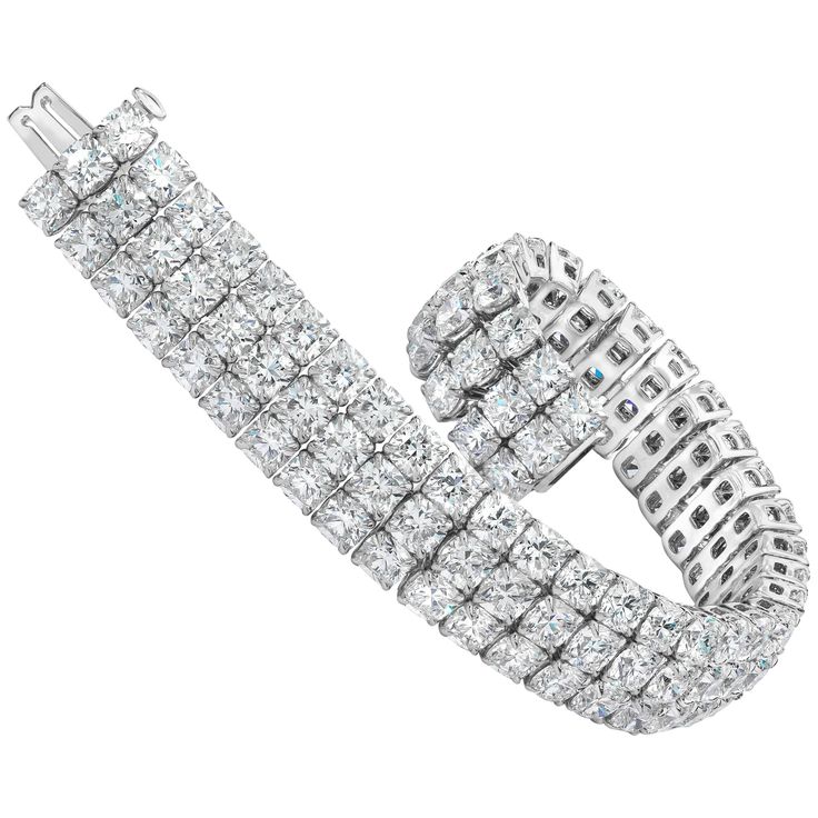 This bracelet features 108 stones of brilliant cushion cut diamonds weighing an astounding 44.30 carats total. All stones are very white and perfectly matched. Set in a three row setting. A very elegant and timeless piece. Style available in different price ranges. Prices are based on your selection of the 4C’s (Carat, Color, Clarity, Cut). Please contact us for more information. Gold Diamond Watches, Dream Bracelet, Black Gold Jewelry, Modern Bracelets, Expensive Jewelry Luxury, Bridal Diamond Jewellery, Antique Bracelets, Cushion Cut Diamond, Jewelry Showcases