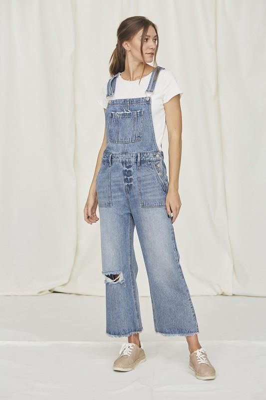 Pair with a cute jean jacket from a trendy denim on denim look. Denim Wide Leg Cropped Overall Distressed Detail Raw Hem Medium Wash Cotton High Rise Cotton Denim Jumpsuit With Button Closure, High-rise Cotton Denim Jumpsuit With Button Closure, Utility Denim Overalls For Everyday, Casual Everyday Overalls For Fall, Casual Everyday Fall Overalls, Relaxed Fit Distressed Denim Overalls, Relaxed Fit Denim Overalls With Distressed Details, Medium Wash Relaxed Fit Bib Front Jeans, Utility Overalls For Everyday Spring Wear