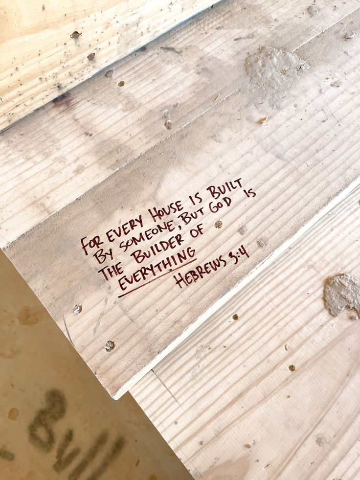 a piece of wood with writing on it