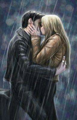 a man and woman kissing in the rain