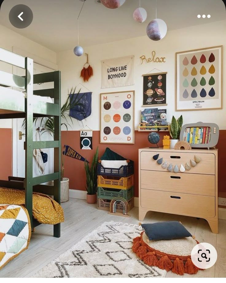 a bedroom with two bunk beds and posters on the wall above it, along with other furniture