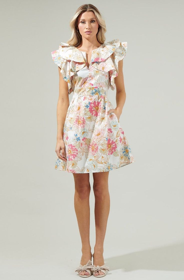 Prepare to captivate all eyes with our exquisite Riley Floral Ruffle Dress! Embellished with delightful ruffles, a flattering split neck, handy pockets, interior lining, and a smocked waist for a flawless silhouette This dress is an essential for every style maven. The stunning Off White Multi hue will ensure you shine bright in any gathering. Embrace this fashionable and sophisticated piece for your wardrobe - a true gem not to be missed! Model is 5'8" and wearing size XS Measurements taken fro Floral Ruffle Dress, All Eyes, Floral Ruffle, All About Eyes, Shine Bright, Ruffle Dress, Ruffles, Split, Off White