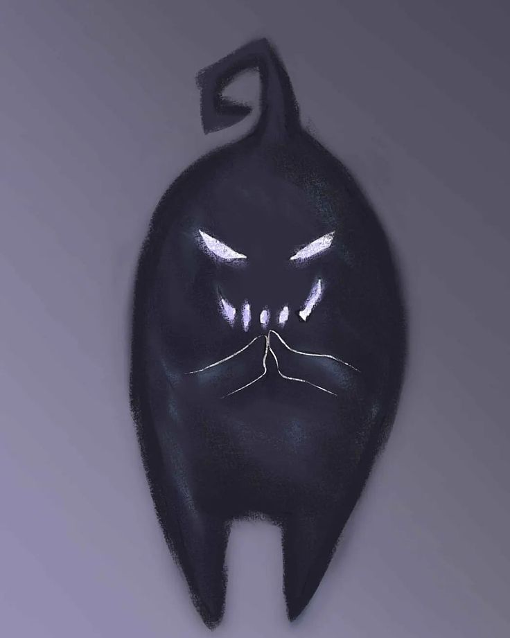 a black cat shaped object with glowing eyes and fangs on it's face, against a gray background