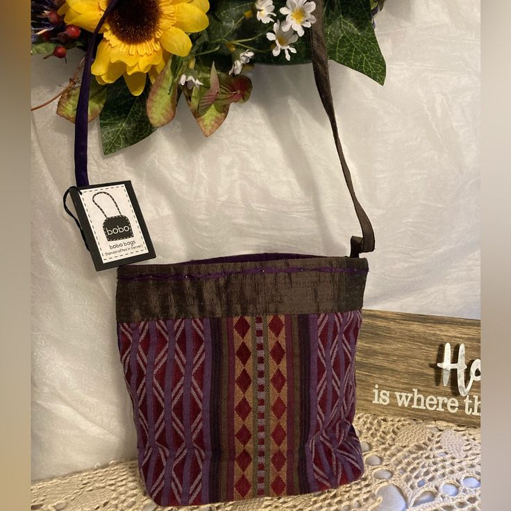 Beautiful Lil Bag Hand Crafted In Denver Colorado. This Is A One Of A Kind Boho Bag With Geometric Silk, Paired With Rich Shantung Silk Trimmed With Silk Ribbon And Handbeaded L-54 Rectangular Purple Hobo Bag For Shopping, Purple Rectangular Hobo Bag For Shopping, Purple Rectangular Hobo Bag For Daily Use, Square Shoulder Bag With Zipper Pouch As Gift, Purple Square Bag For Gift, Purple Rectangular Hobo Bag For Travel, Rectangular Purple Bucket Bag For Travel, Purple Bag With Zipper Pouch For Daily Use, Crossbody Shoulder Bag For Shopping With Zipper Pouch