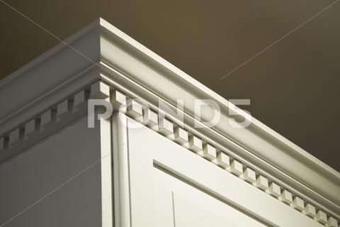 the corner of a building with white trim