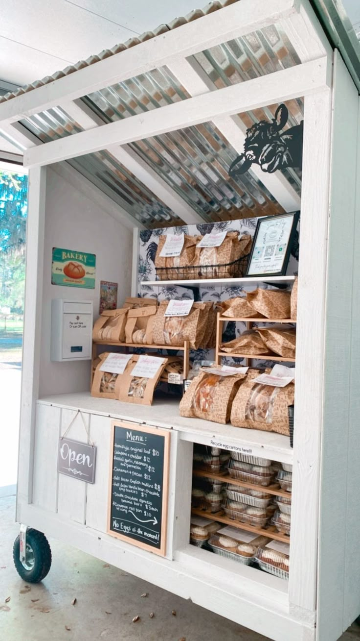 the food cart has bread and other items on it