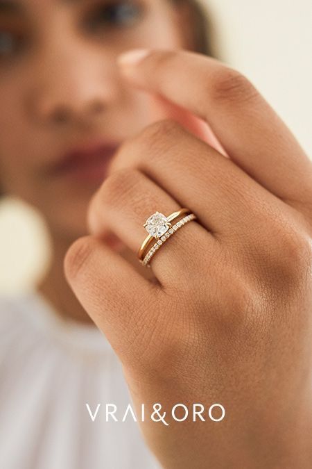 a woman is wearing a diamond ring