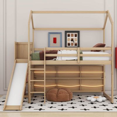 a child's bedroom with a slide and bunk bed