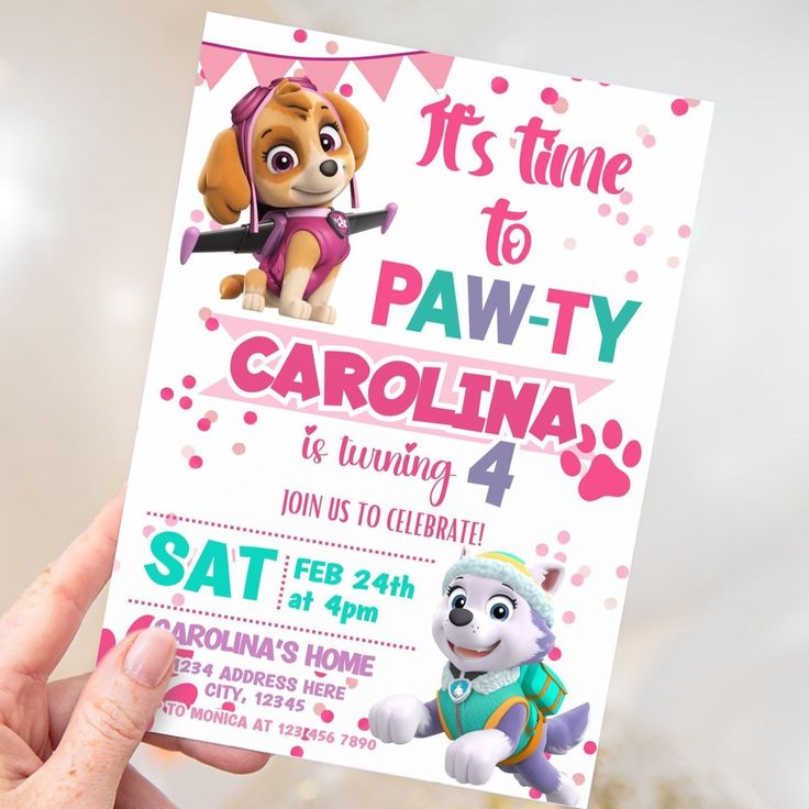 a person holding up a paw patrol birthday card