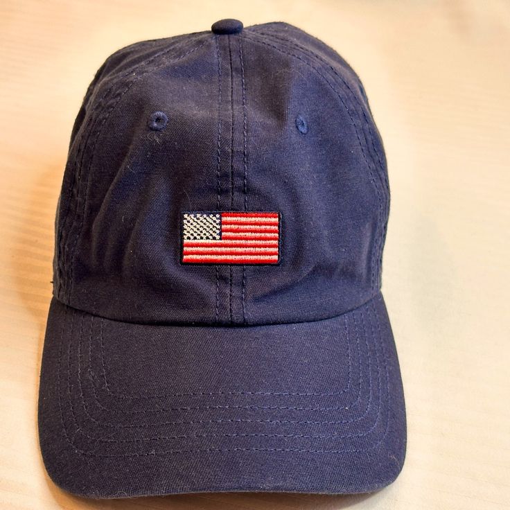 Eddie Bauer Baseball Cap With Cloth Adjustable Strap. Comfortable To Wear, Displays The American Flag In The Front. Never Worn. 100%Cotton Navy Casual Baseball Cap With Flat Bill, Navy Casual Flat Bill Baseball Cap, Navy Adjustable Casual Dad Hat, Navy Casual Adjustable Dad Hat, Casual Adjustable Hats Made In Usa, Navy Cotton Casual Hats, Casual Navy Cotton Hat, Blue Cotton Baseball Cap With Flat Bill, Blue Patriotic Adjustable Baseball Cap