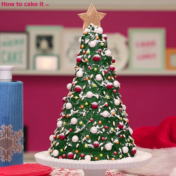 a decorated christmas tree sitting on top of a white plate