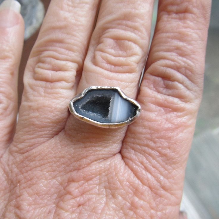 "Silver Mini Geode Ring Gray Druzy Ring Sparkly Druse Gemstone Ring: A stunning, one-of-a-kind, handmade stackable ring featuring a natural sparkling druzy geode set in sterling silver. The geode is gray and white and it measures 11/16\" by 7/16\". Band is 1/16\" wide. The ring itself is a size 6. Completely handmade by myself in sterling silver. Enter my shop: https://www.etsy.com/shop/artdi Join me on Facebook: https://www.facebook.com/Artdi-Diana-Anton-Jewelry-Design-44805607932/ Find me on I Spiritual Stackable Crystal Open Ring, Spiritual Stackable Open Crystal Ring, Unique Adjustable Rings With Natural Stones, Agate Gemstone Promise Ring, Adjustable Silver Stackable Rings With Stones, Unique Stackable Crystal Ring As Gift, Adjustable Stackable Rings With Natural Stones, Unique Stackable Crystal Ring For Gift, Artisan Open Ring With Natural Stones