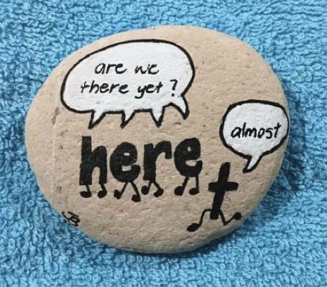 a rock with two speech bubbles on it that says, are we there yet? almost