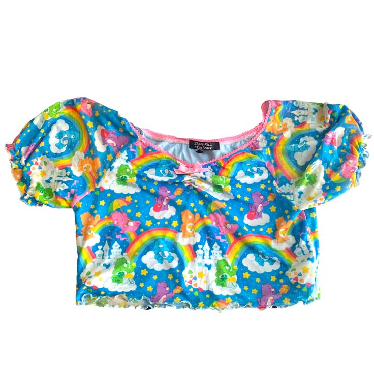 Smoke-Free Home - Cat-Friendly Home Description: Spread Happiness With The Dolls Kill X Care Bears Sharing Is Caring Mesh Top! This Adorable Crop Top Features A Double-Layer Mesh Construction, Adorned With Your Favorite Care Bears And Rainbows All Over. The Puff Sleeves And Tricot Lace Trim Add A Touch Of Sweetness To This Charming Top. Plus, It's Very Stretchy For A Comfortable Fit. Get Ready To Share The Love With This Cute And Playful Care Bears Shirt! Checkout My Closet For The Coordinating Fitted Rainbow Short Sleeve Tops, Fitted Pink Tops With Cartoon Print, Blue Top With Rainbow Print For Spring, Blue Tops With Rainbow Print For Spring, Playful Pink Tops With Rainbow Print, Playful Rainbow Print Top, Kawaii Fitted Tops For Spring, Cute Short Sleeve Tops With Unicorn Print, Pink Fitted Kawaii Top