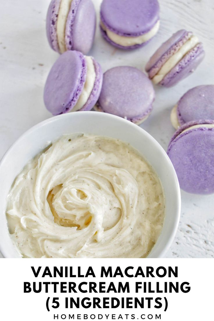 vanilla macaron buttercream filling in a white bowl next to purple cookies