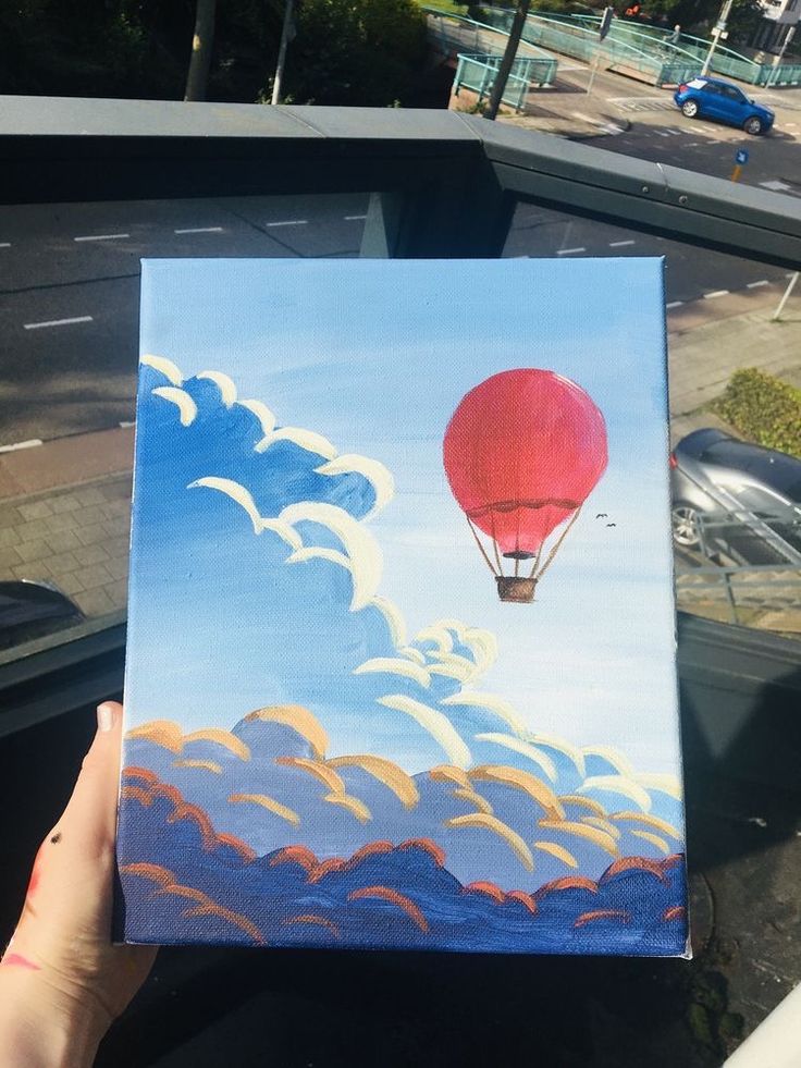 a painting of a hot air balloon in the sky