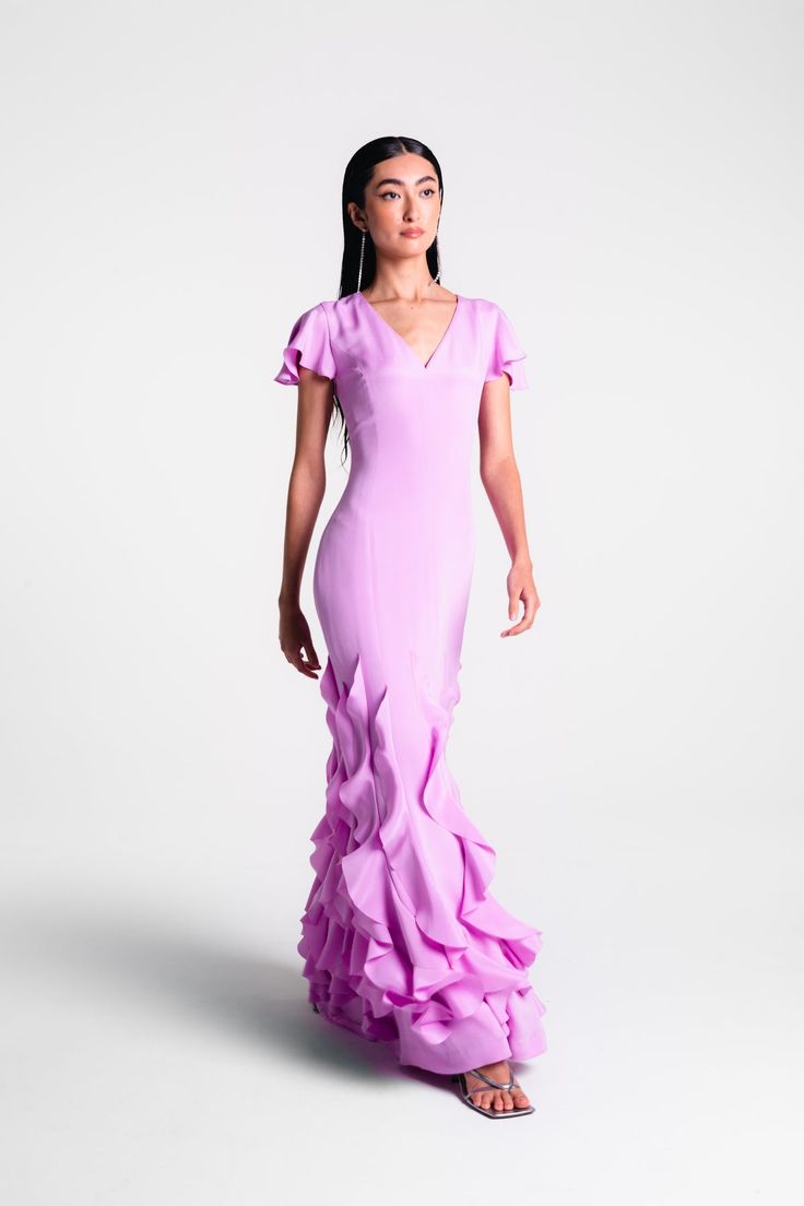 V Neck Gown with Ruffle Hem. DESCRIPTION Colour: Lilac Piped v neck, fitted bodice, slim fitted skirt, ruffle detail on hem Hidden zipper & hook and eye Composition: 100% Silk Self and silk habotai lined Dry clean only Made in Canada SIZE & FIT Fit: true to size. Model height is 5’10” and is wearing a size 4 Ma V Neck Gown, Skirt Ruffle, Add Sleeves, Fashion Gowns, Fitted Skirt, Silk Crepe, Fitted Bodice, Ruffle Hem, Beautiful Dresses