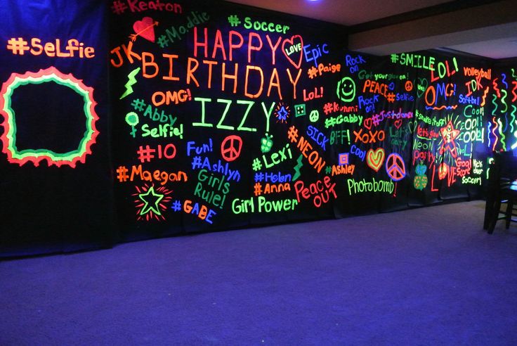 a room filled with lots of neon writing on the wall