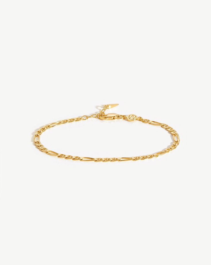 Filia Chain Bracelet | 18ct Gold Plated Vermeil. An Iconic Chain to Wear Your Way. Featuring Retro-Inspired Interlocking Links, this Delicate Bracelet Easily Fastens with a Claw Clasp. Wear as a Pared Back Solo Piece, or Create Contrast with a Chunky T-Bar Chain. Metal: 18Ct Gold Plated Vermeil on Sterling Silver Total Length: 185mm with Extension from 165mm to 185mm Chain Width: 3. 5mm Weight: 2. 9g Product Code: Cr-G-B5-Ns Timeless Cable Chain Bracelet, Luxury Figaro Chain Bracelet With Oval Link, Luxury Oval Link Chain Bracelet With Figaro Chain, Timeless Gold Chain Bracelet, Formal Oval Link Delicate Chain Bracelet, Oval Link Figaro Chain Gold Bracelet, Elegant Figaro Chain Bracelet, Classic Adjustable Chain Bracelet With Oval Links, Timeless Gold Bracelet With Adjustable Link Chain