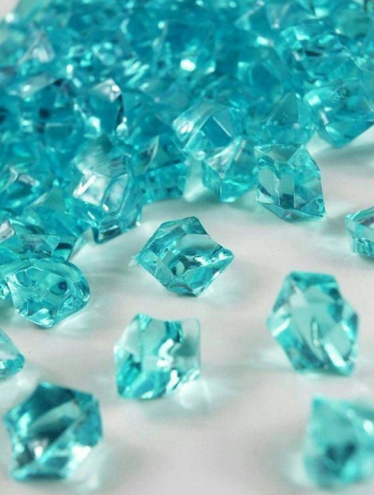 some very pretty blue diamonds on a white surface