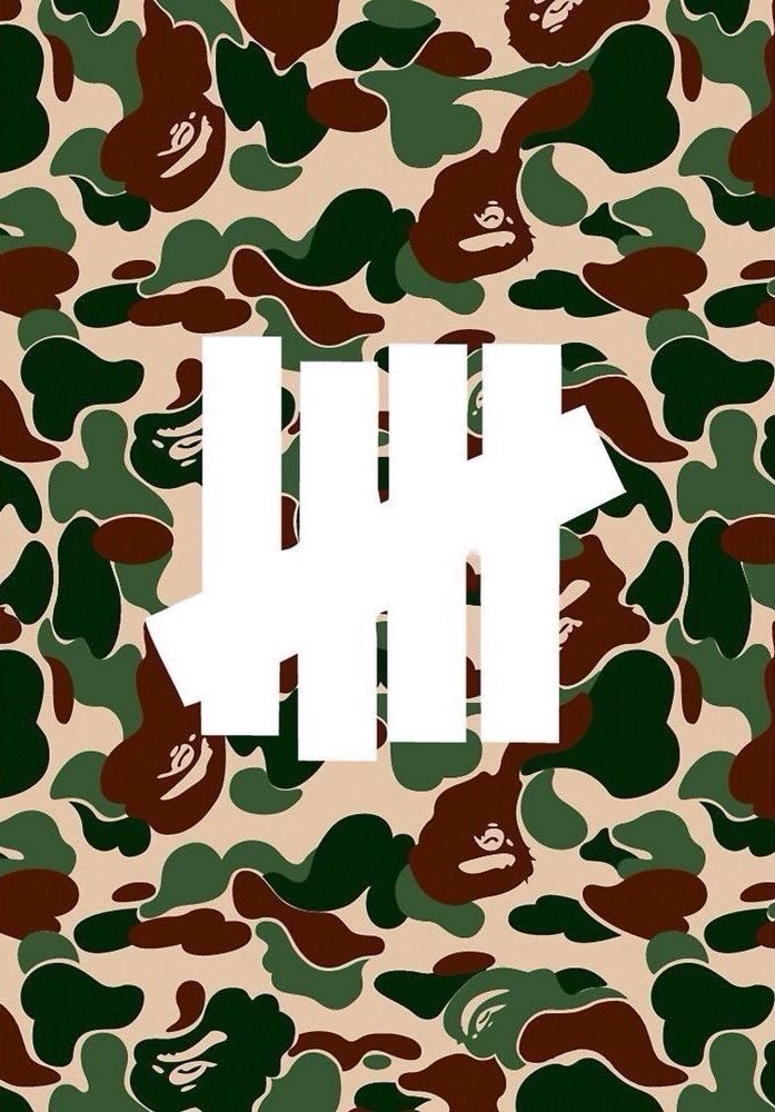 a camouflage print with the letter h on it