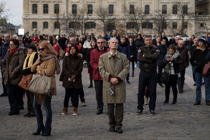 a large group of people standing in front of a building