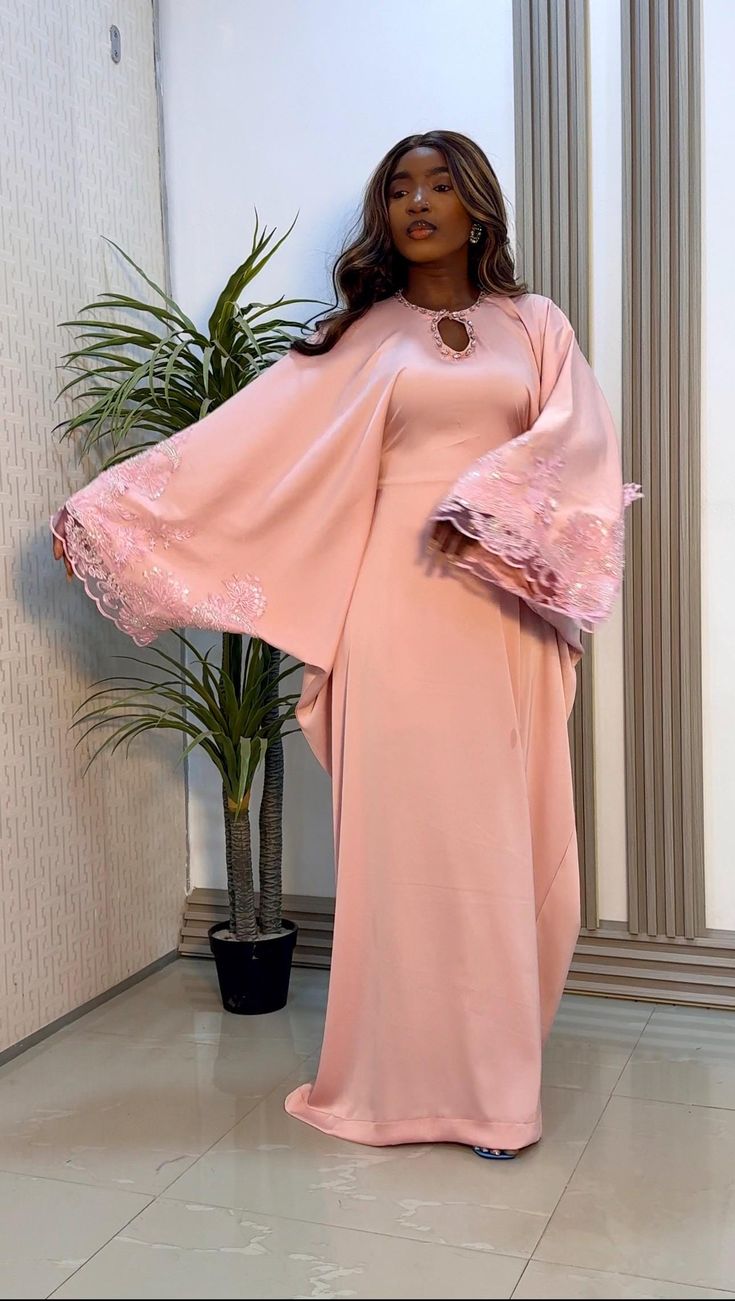 Indulge in elegance with our Luxury Silk Bubu in Peach. Crafted with the finest silk, this stunning gown features intricate lace detailing and a unique cutout. Elegant Pink Maxi Dress For Banquets, Pink Lace Long Sleeve Evening Dress, Pink Long Sleeve Lace Evening Dress, Long Sleeve Pink Lace Evening Dress, Pink Lace Floor-length Dress, Pink Floor-length Lace Dress, Pink Lace Maxi Dress For Wedding, Pink Lace Maxi Dress With Patchwork, Pink Maxi Lace Wedding Dress