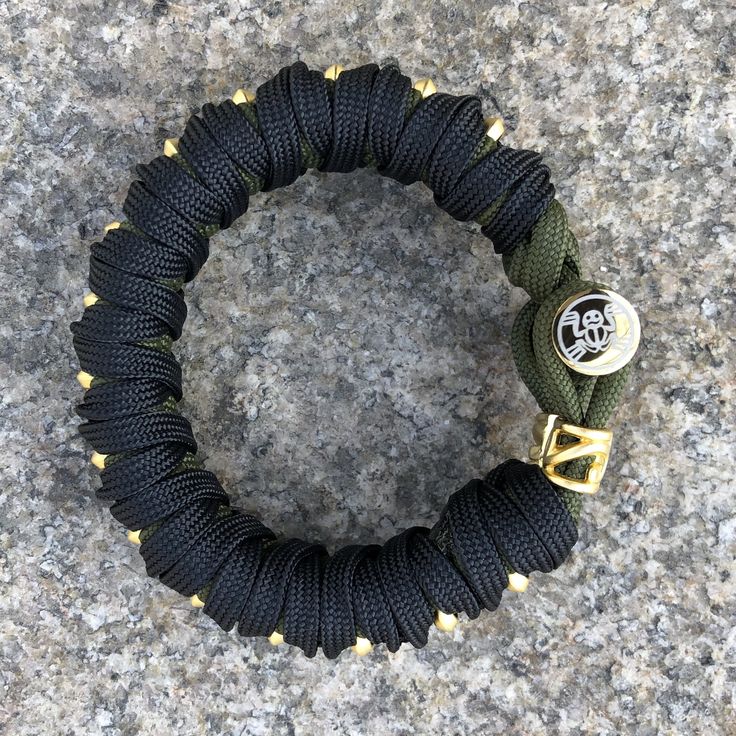 Original tsukamaki katana and BOKKEN wrap design bracelet with KRÜGER steel bar closure and brass or steel beads running down the center. Chose black and gold or white and steel design, or tell me in the comments which cord colors you prefer. Exact type of center bead design might vary slightly depending on availability. Adjustable Durable Gold Bracelets, Adjustable Gold Paracord Bracelets, Adjustable Gold Paracord Bracelet, Design Bracelet, Bar Bracelets, Steel Bar, Steel Design, Bead Designs, Bracelet Designs