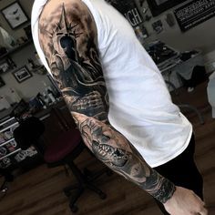 a man with a tattoo on his arm