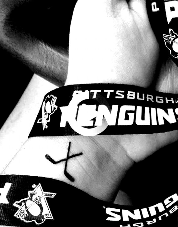 two wristbands with the words penguins and hockey stickers on them are shown in black and white