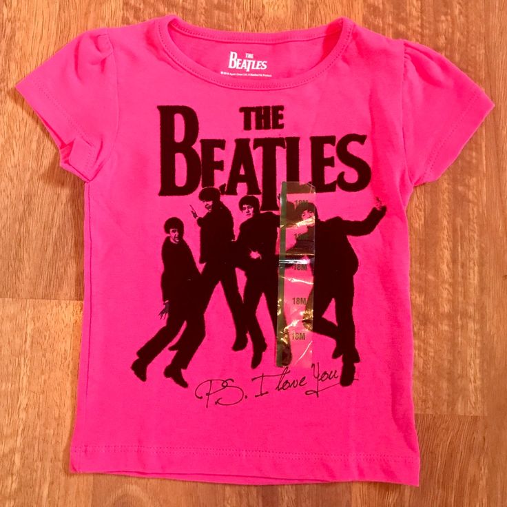 a pink shirt with the beatles on it