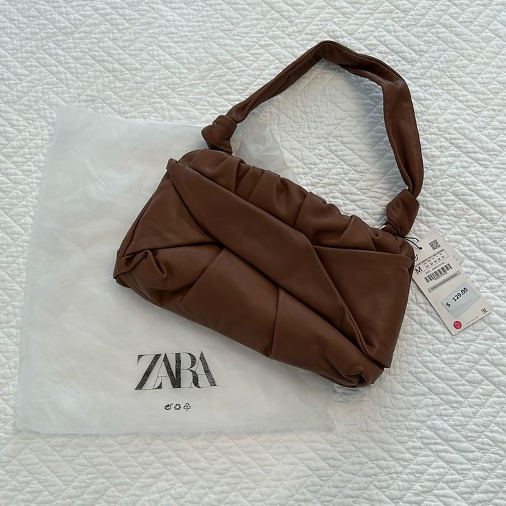 Gorgeous Knot-Style Tan Leather Bag From Zara. Zippered Top (Note Zipper Is A Bit Stiff As The Bag Is Nwt). Retail $129. Dust Bag Included Chic Brown Pouch Baguette Bag, Chic Brown Baguette Bag Clutch, Trendy Brown Zara Shoulder Bag, Zara Brown Bags For Daily Use, Zara Brown Everyday Bag, Everyday Brown Zara Bag, Zara Clutch Shoulder Bag For Everyday Use, Zara Clutch Shoulder Bag, Trendy Zara Pouch Shoulder Bag