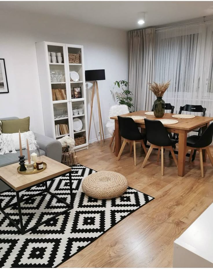 a living room filled with furniture and a wooden table