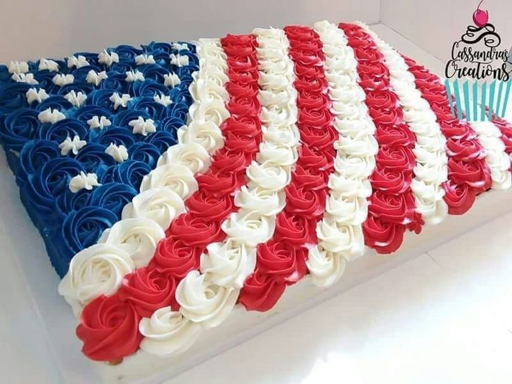 an american flag cake with red, white and blue frosting on it's side