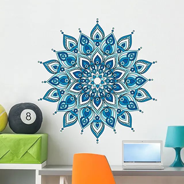 a blue and white wall decal with an intricate design on the side of it