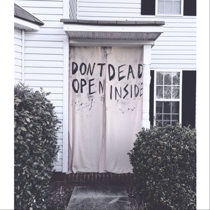 an open door to a white house with the words down dead open inside written on it