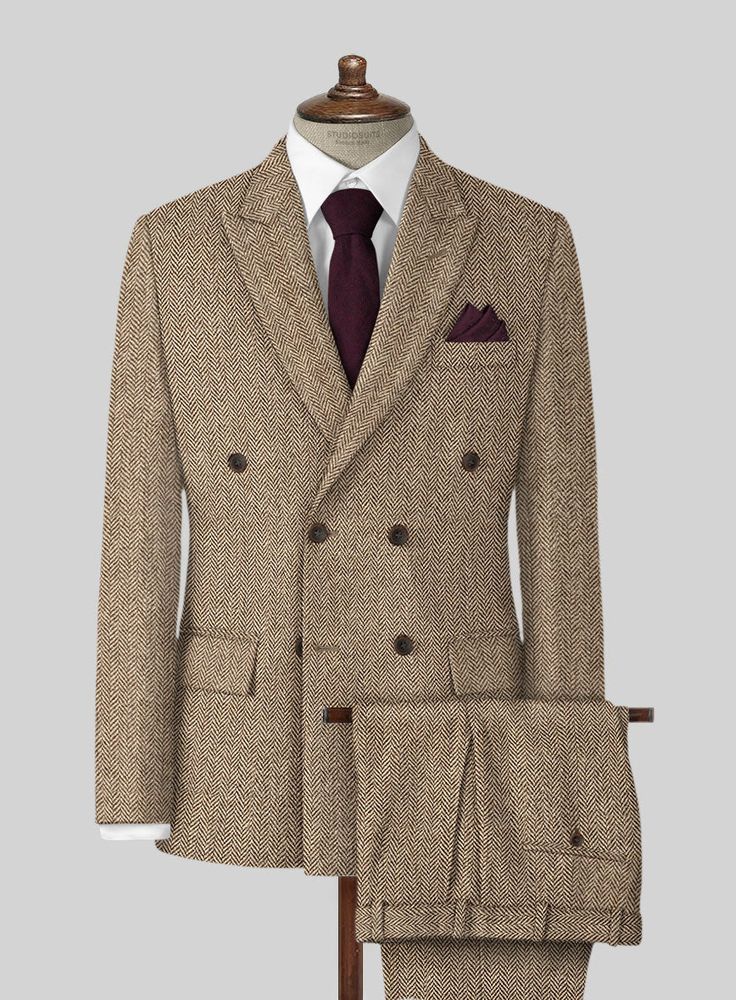 The Irish Brown Herringbone Tweed Suit will become the standard of business dressing and by far the most ubiquitous option. Crafted from wool, the Irish Brown color of the suit will surely influence a veteran dresser to buy the suit for building a sharp wardrobe. Team it up with a white shirt and dark brown derby shoes. 
 
 Look Includes  Irish Brown Herringbone Tweed Fabric  Double Breasted Jacket Style  Peak Lapel  Horn Brown Buttons  Single Vent  Three Cuff Buttons  Two Welted Back Pockets on Tweed Three-piece Suit With Notch Lapel For Work, Brown Wool Suit With Herringbone Pattern, Classic Tweed Suits With Suit Collar, Wool Suits With Herringbone Pattern For Business Casual, Formal Tweed Three-piece Suit With Notch Lapel, Tweed Three-piece Suit With Notch Lapel For Business, Classic Herringbone Suit For Semi-formal Occasions, Classic Semi-formal Suit With Herringbone Pattern, Formal Tweed Suit With Suit Collar