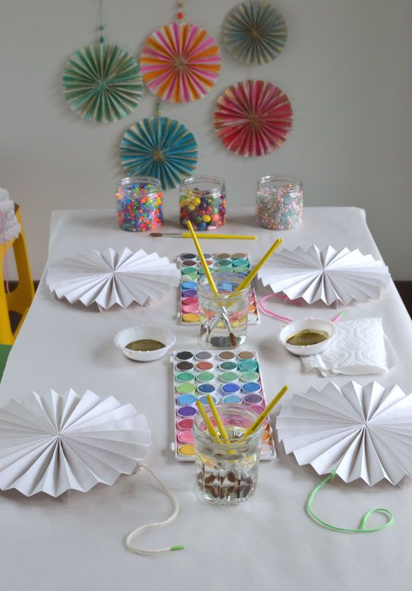 the table is set up with paper fans